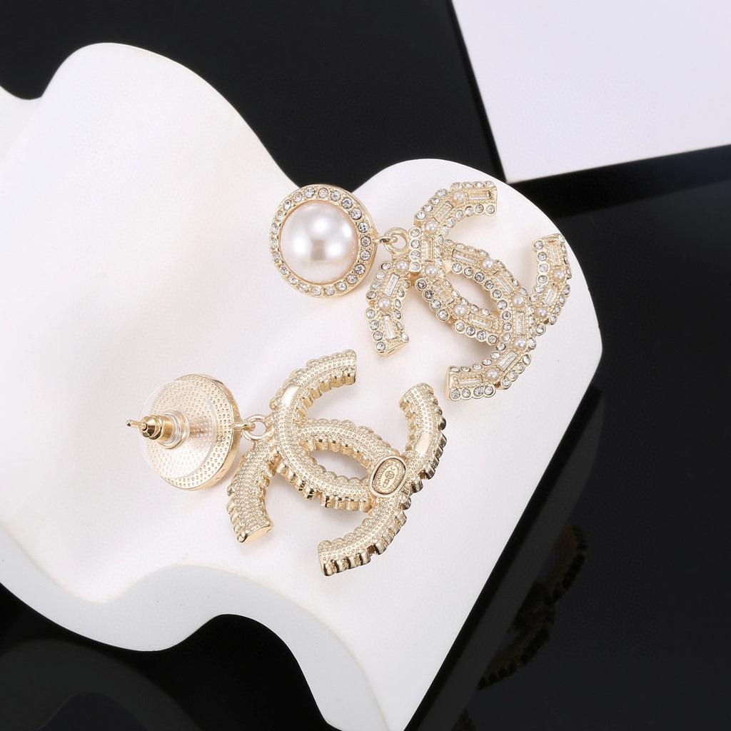 Double-C Emblem Pearl-Detail Stud Earrings – Pearl Detail close-up detail