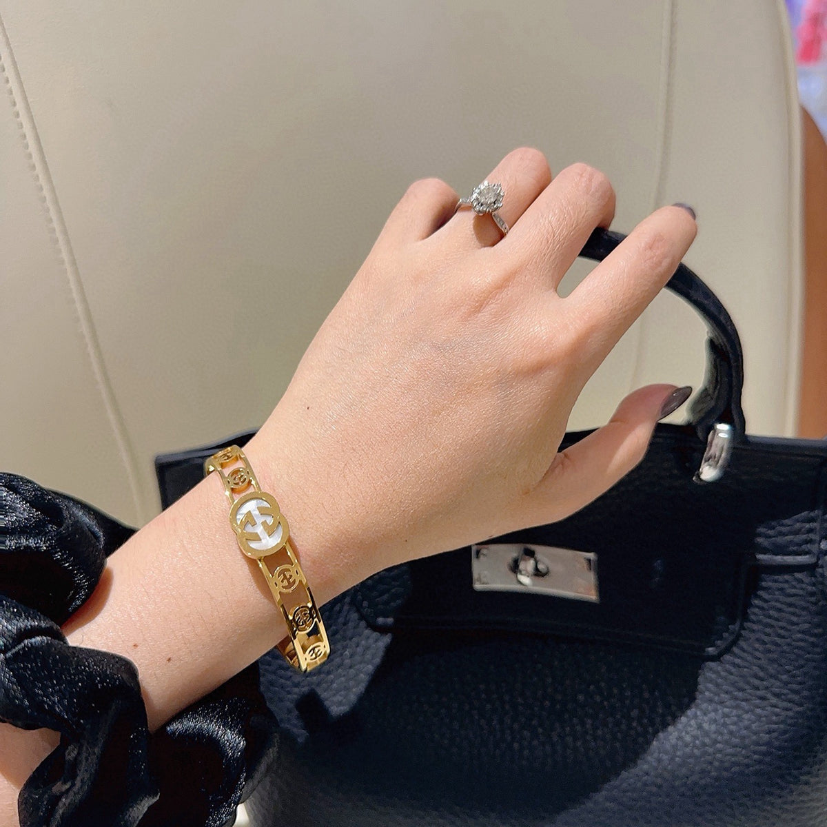 Double-G Emblem Bangle in Polished Metal-Tone – Design 017 detail view