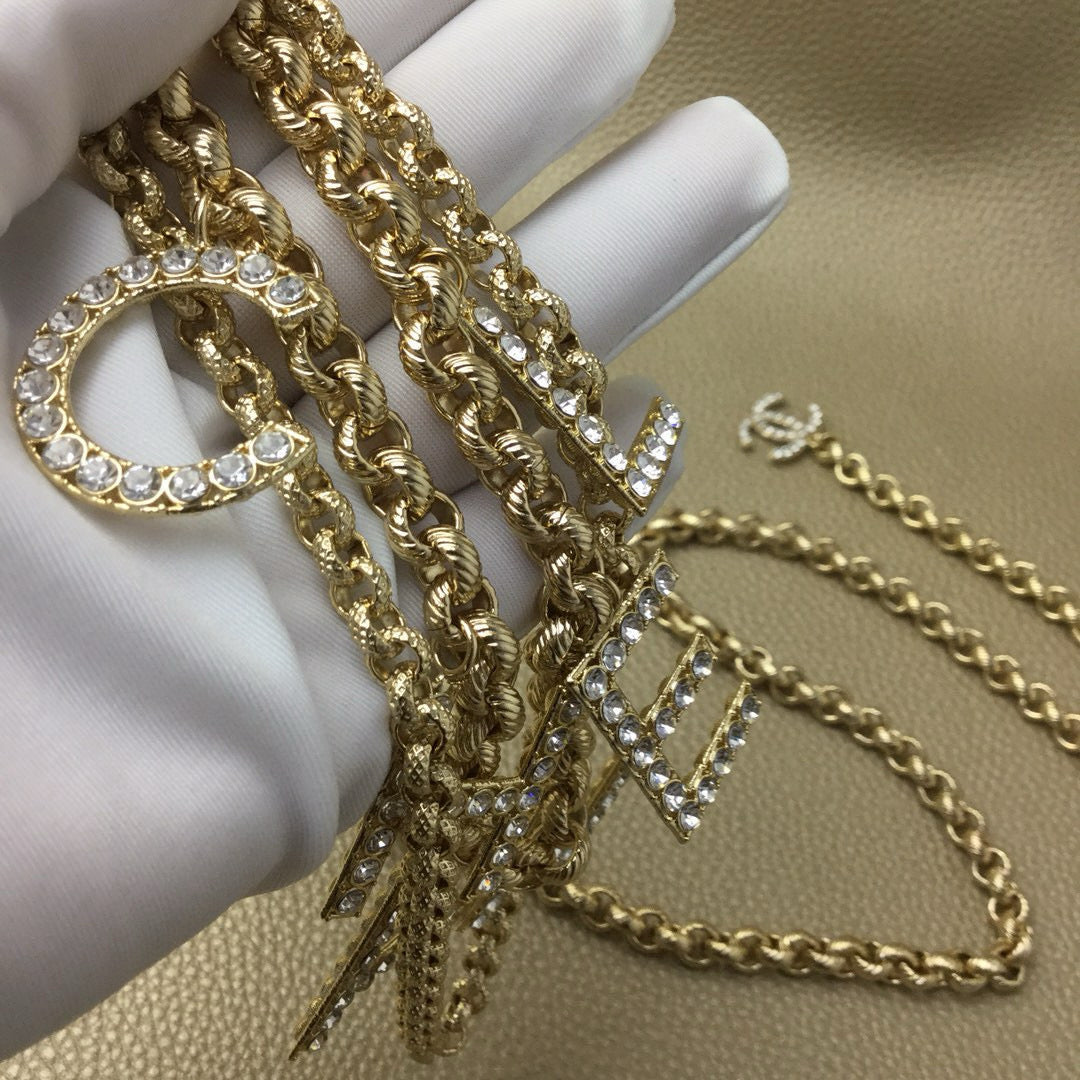 Signature Emblem Jewelry Accessory in Polished Metal-Tone – White Detail main product view