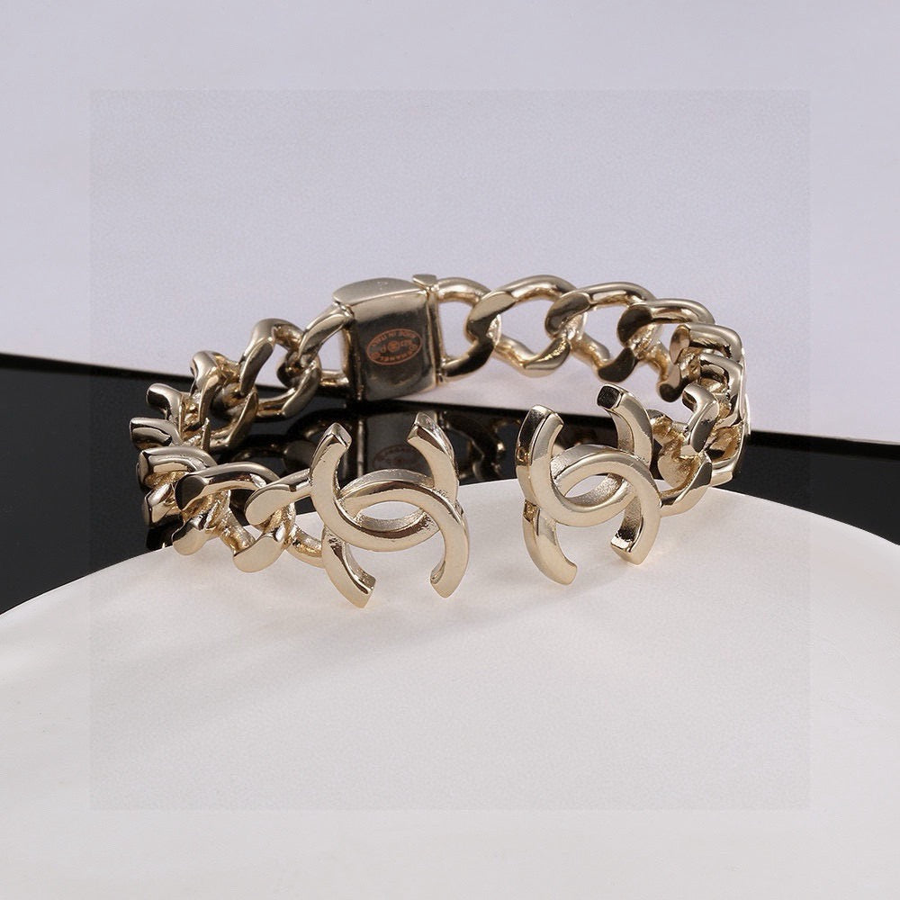 Signature Emblem Bangle in Polished Metal-Tone – Design 016 front product view