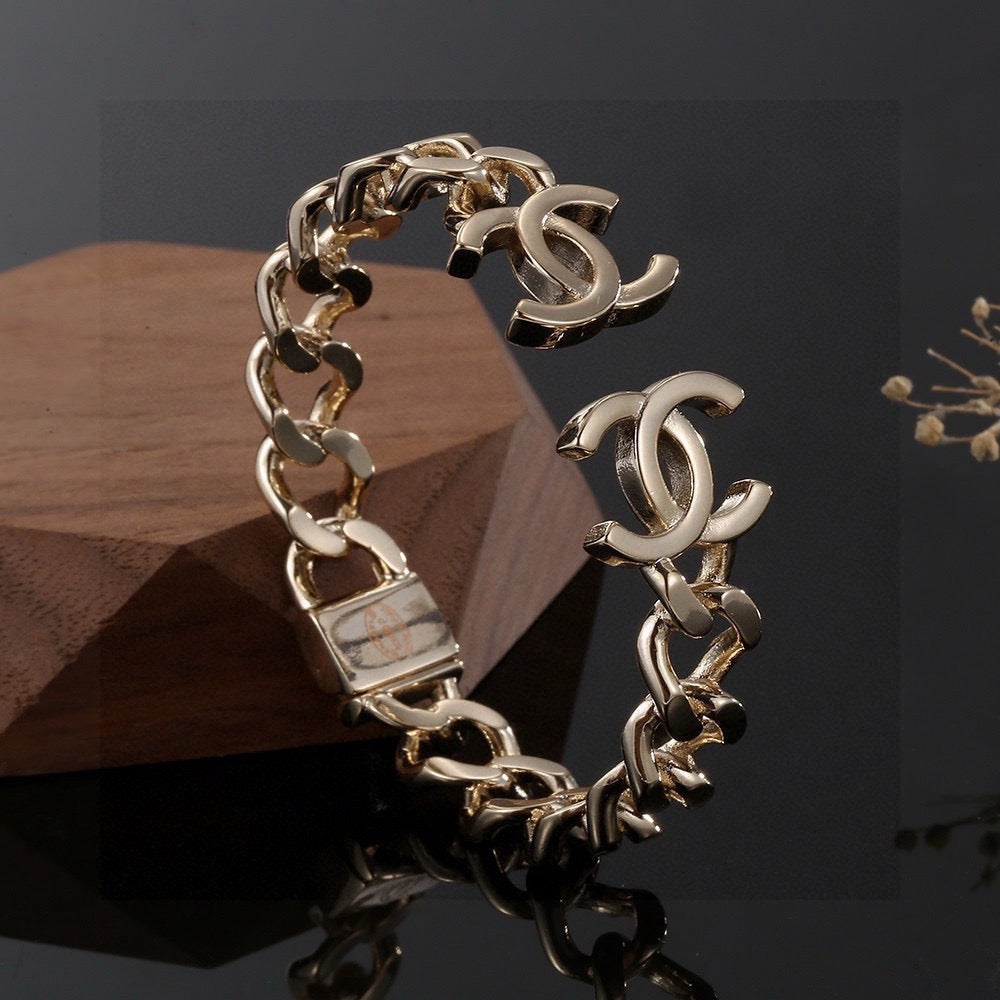 Signature Emblem Bangle in Polished Metal-Tone – Design 016 front product view
