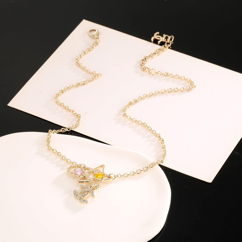 Double-C Emblem Crystal-Accent Pendant Necklace – Star Detail side detail