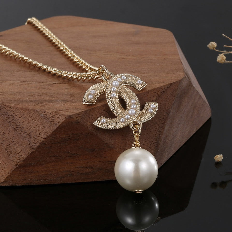 Double-C Emblem Pearl-Detail Pendant Necklace – Pearl Detail – Design 056 close-up detail