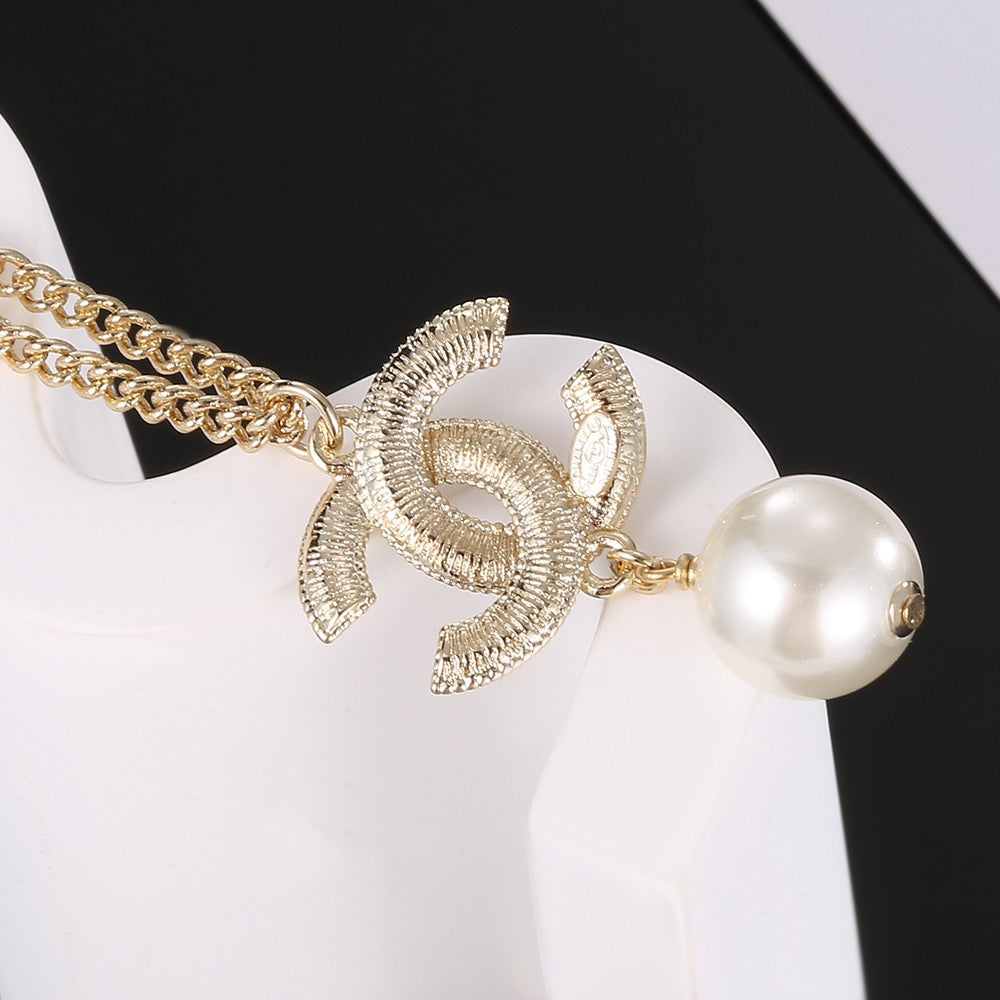 Double-C Emblem Pearl-Detail Pendant Necklace – Pearl Detail – Design 056 detail view