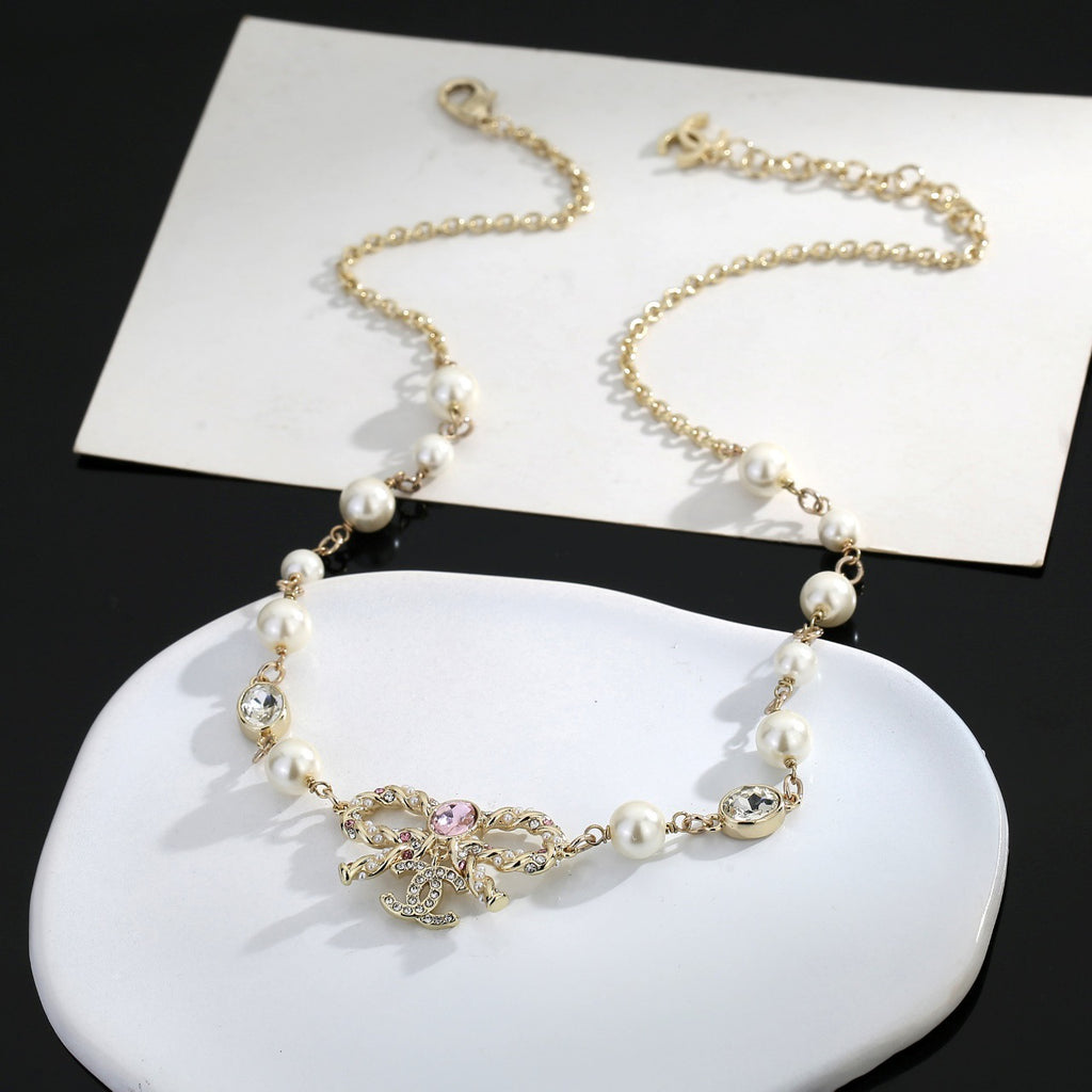 Bow Pearl-Detail Pendant Necklace – Pearl Detail – Design 005 styled product view