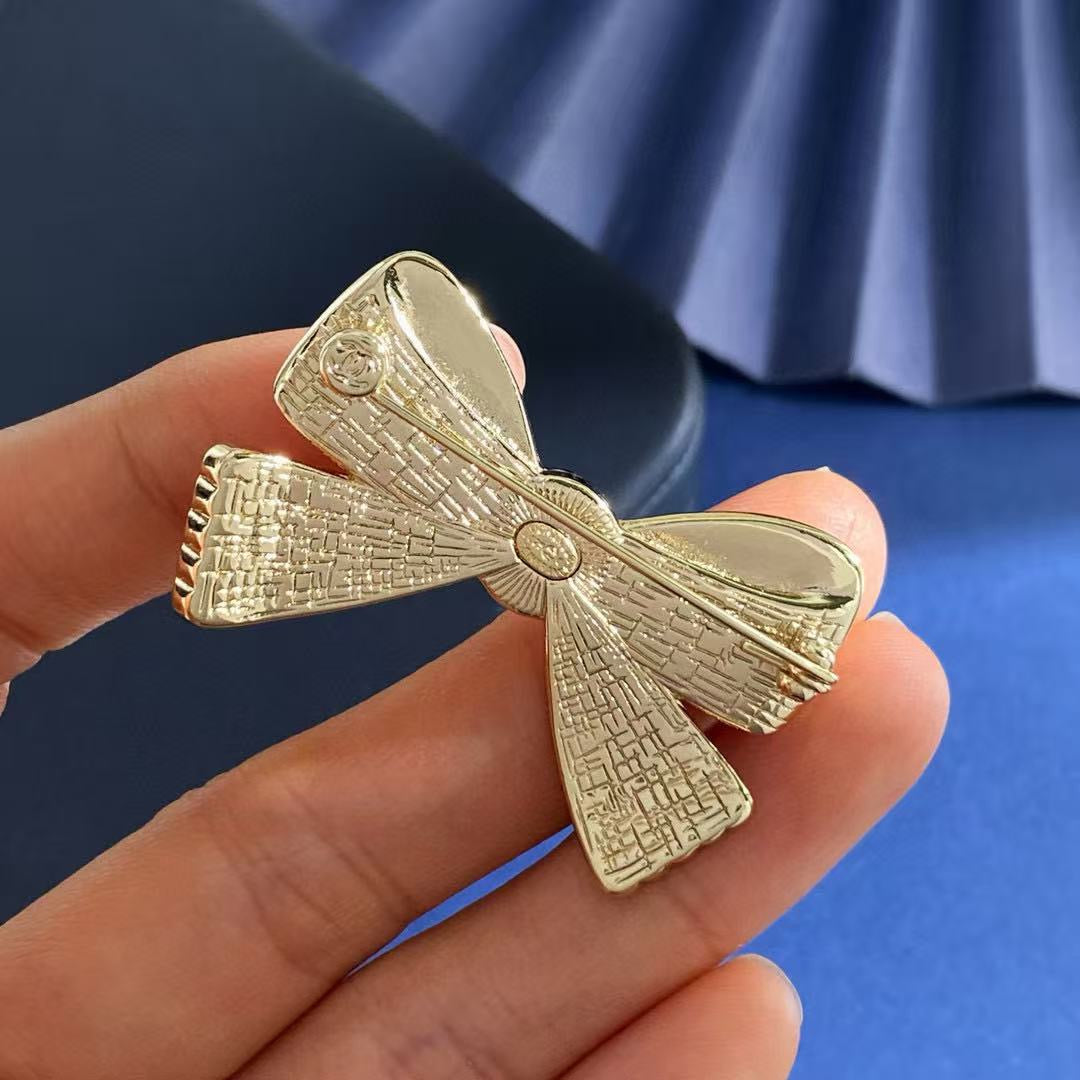 Bow Brooch in Polished Metal-Tone front product view