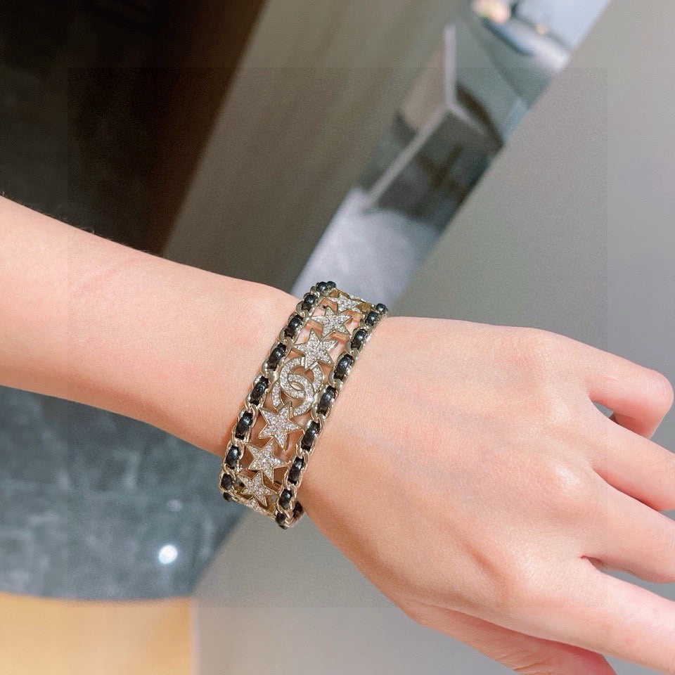 Signature Emblem Bangle in Polished Metal-Tone – Black Detail – Design 007 close-up detail
