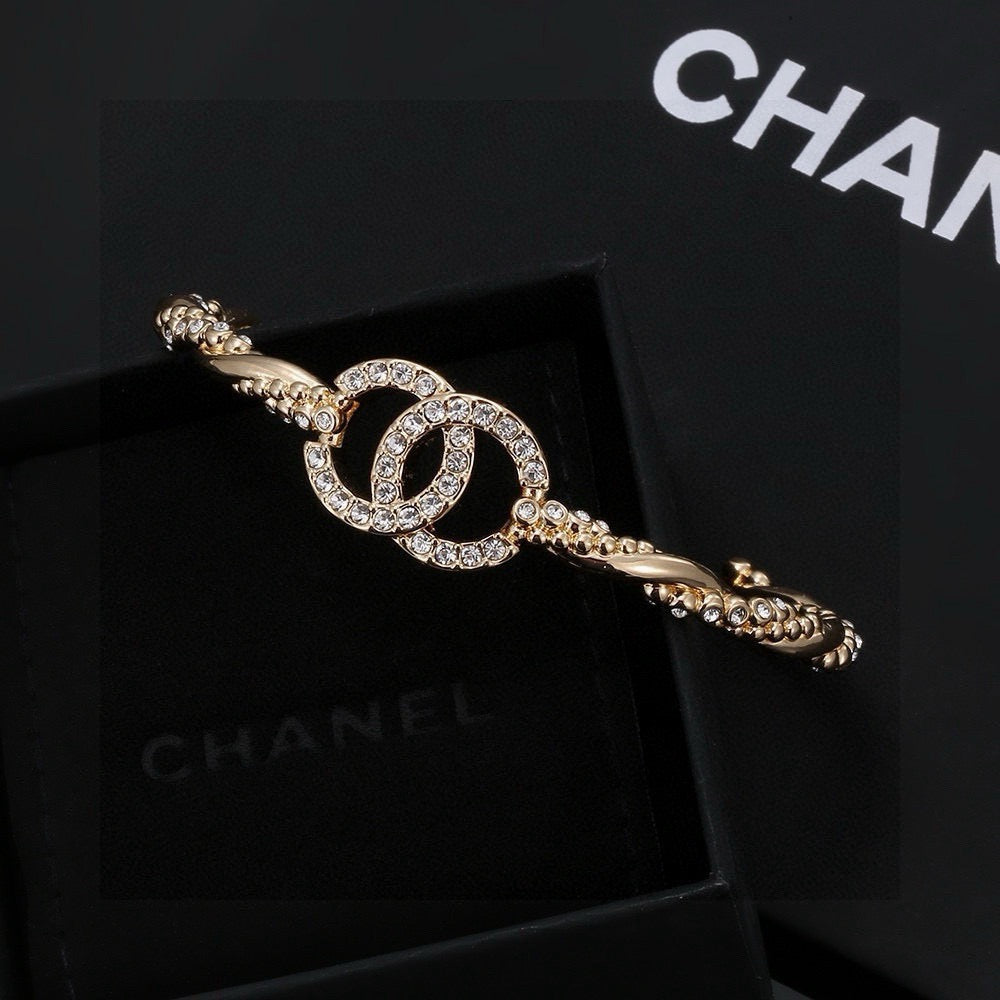 Signature Emblem Bangle in Polished Metal-Tone – Design 021 front product view