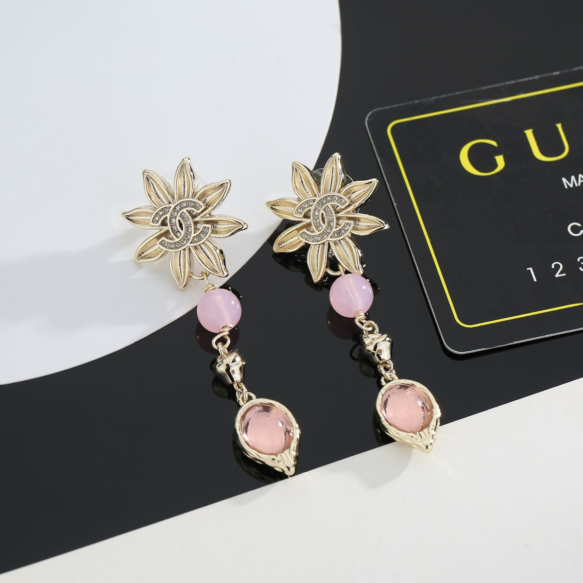 Double-C Emblem Stud Earrings in Gold-Tone – Design 019 detail view