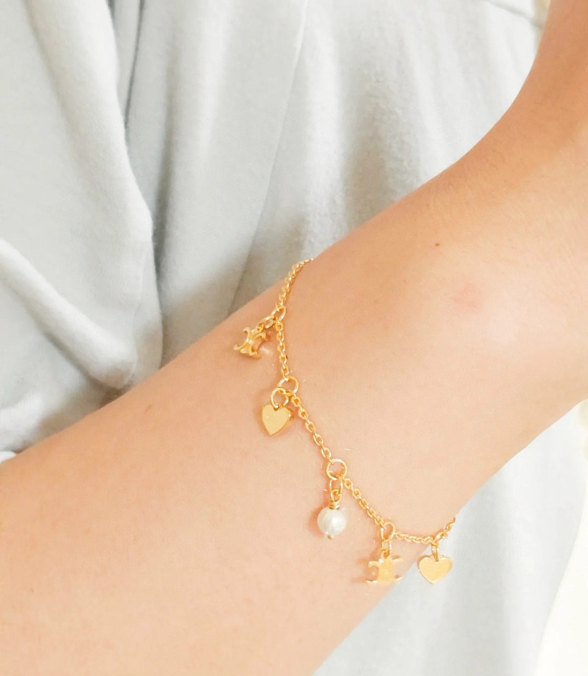 Signature Emblem Bracelet in Polished Metal-Tone – Red Detail front product view
