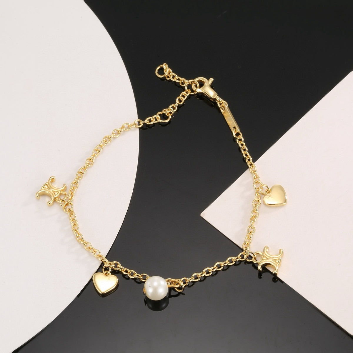 Signature Emblem Bracelet in Polished Metal-Tone – Red Detail detail view