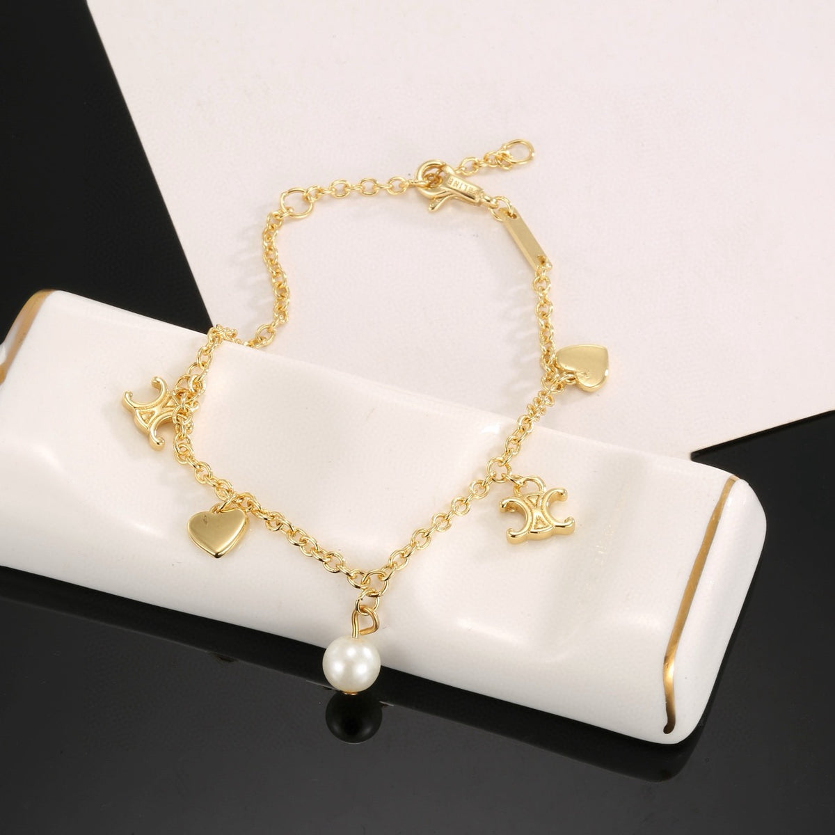 Signature Emblem Bracelet in Polished Metal-Tone – Red Detail side detail