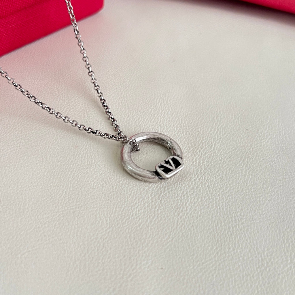 Signature Emblem Pendant Necklace in Polished Metal-Tone – Design 02 close-up view