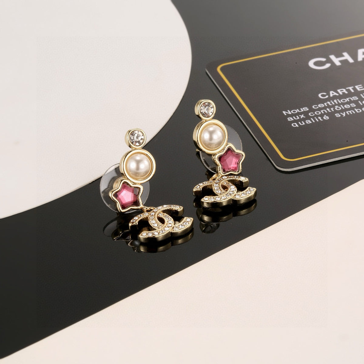 Double-C Emblem Stud Earrings in Gold-Tone – Star Detail – Design 006 close-up detail