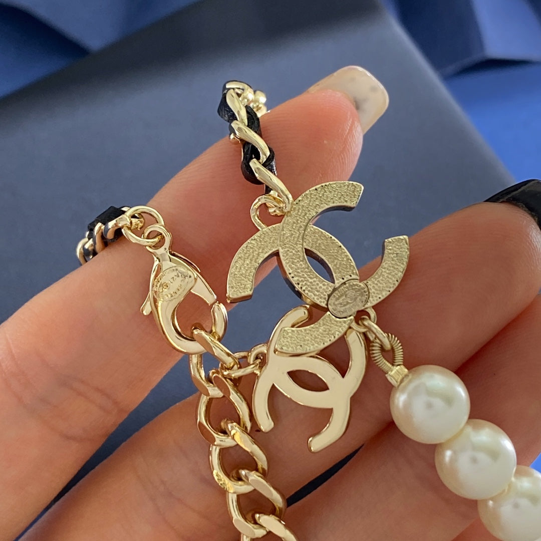 Double-C Emblem Pearl-Detail Pendant Necklace – Pearl Detail – Design 111 styled product view