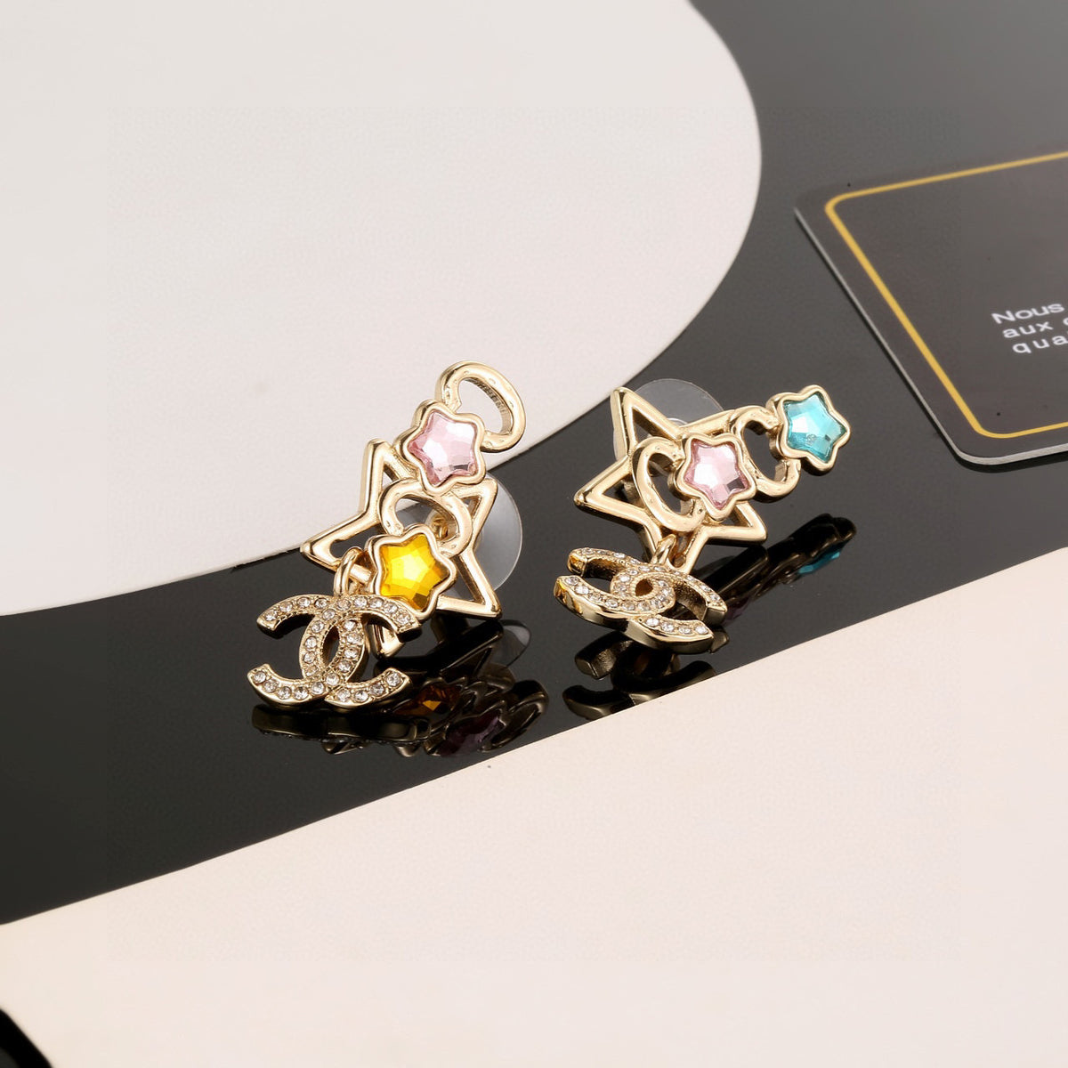 Double-C Emblem Stud Earrings in Gold-Tone – Star Detail – Design 005 detail view
