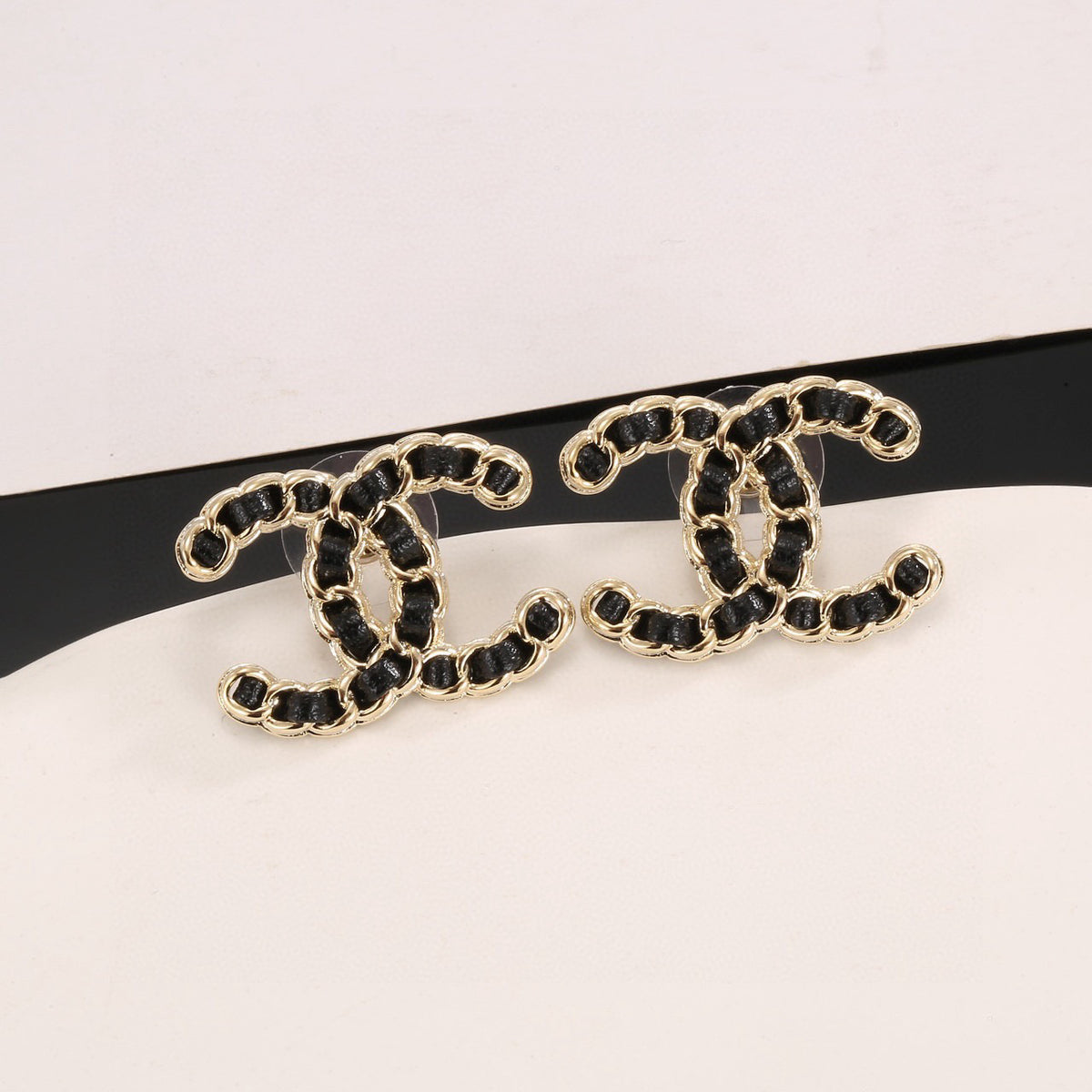 Signature Emblem Stud Earrings in Polished Metal-Tone – Black Detail front product view