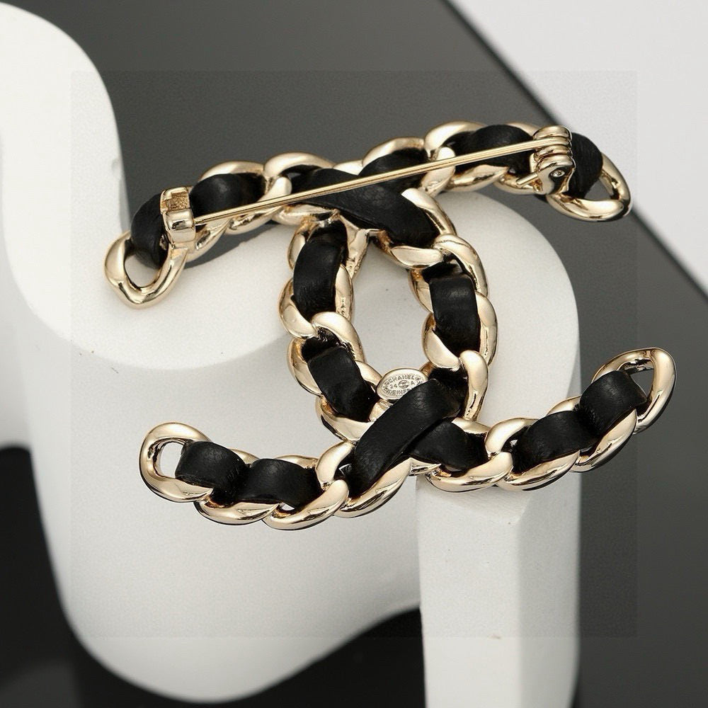 Signature Emblem Brooch in Polished Metal-Tone – Black Detail – Design 002 styled product view
