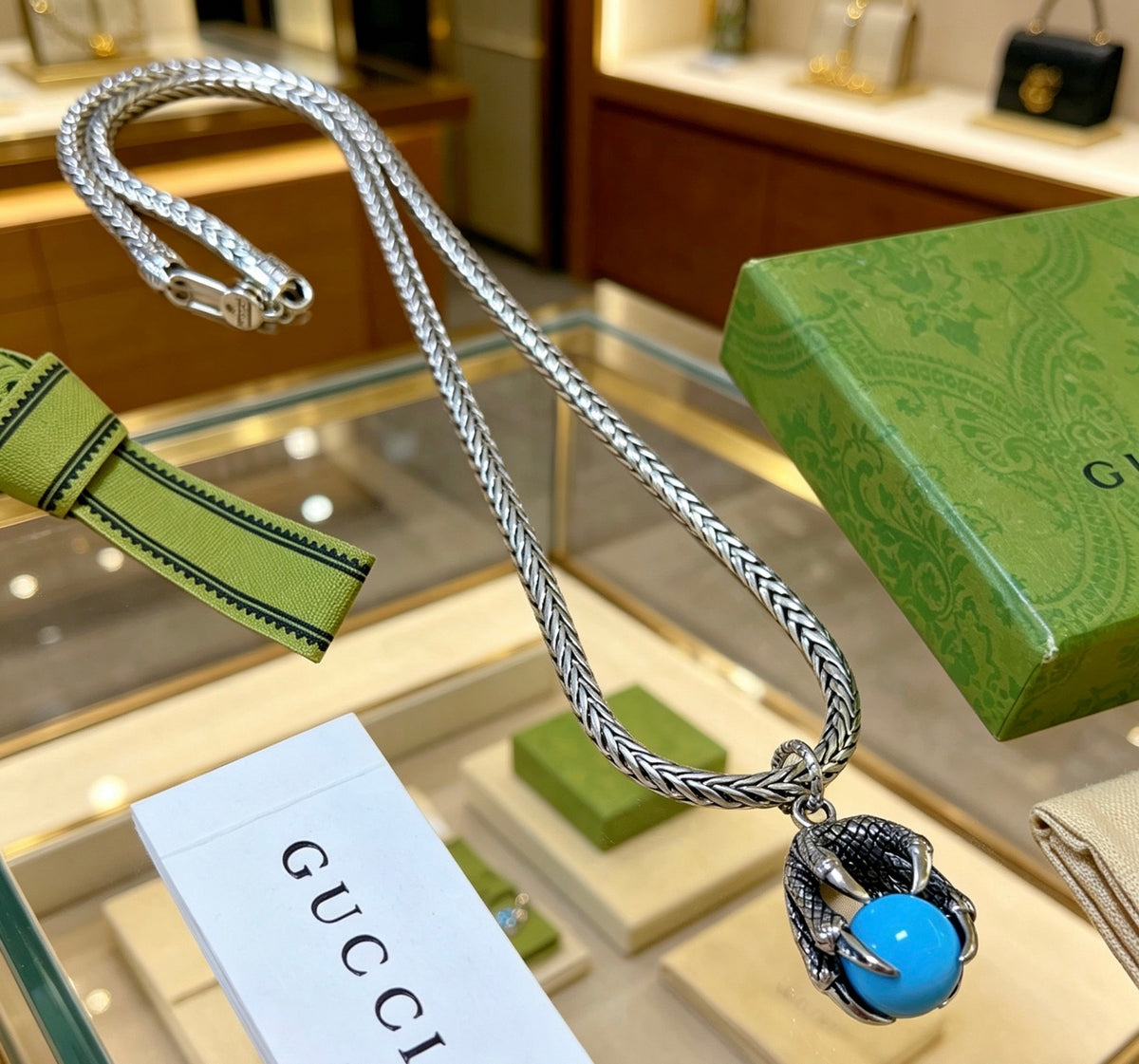 Double-G Emblem Pendant Necklace in Polished Metal-Tone – Turquoise Detail side detail
