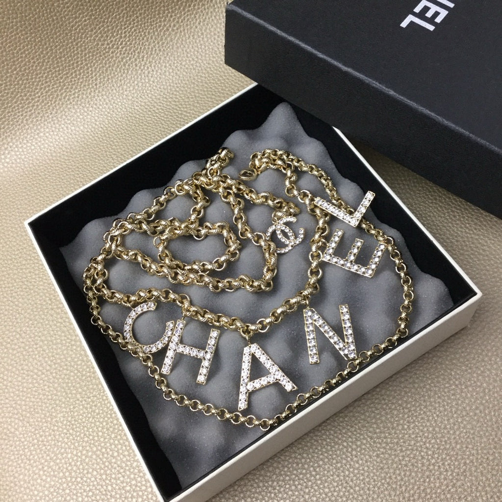 Signature Emblem Jewelry Accessory in Gold-Tone – White Detail – Design 004 front product view