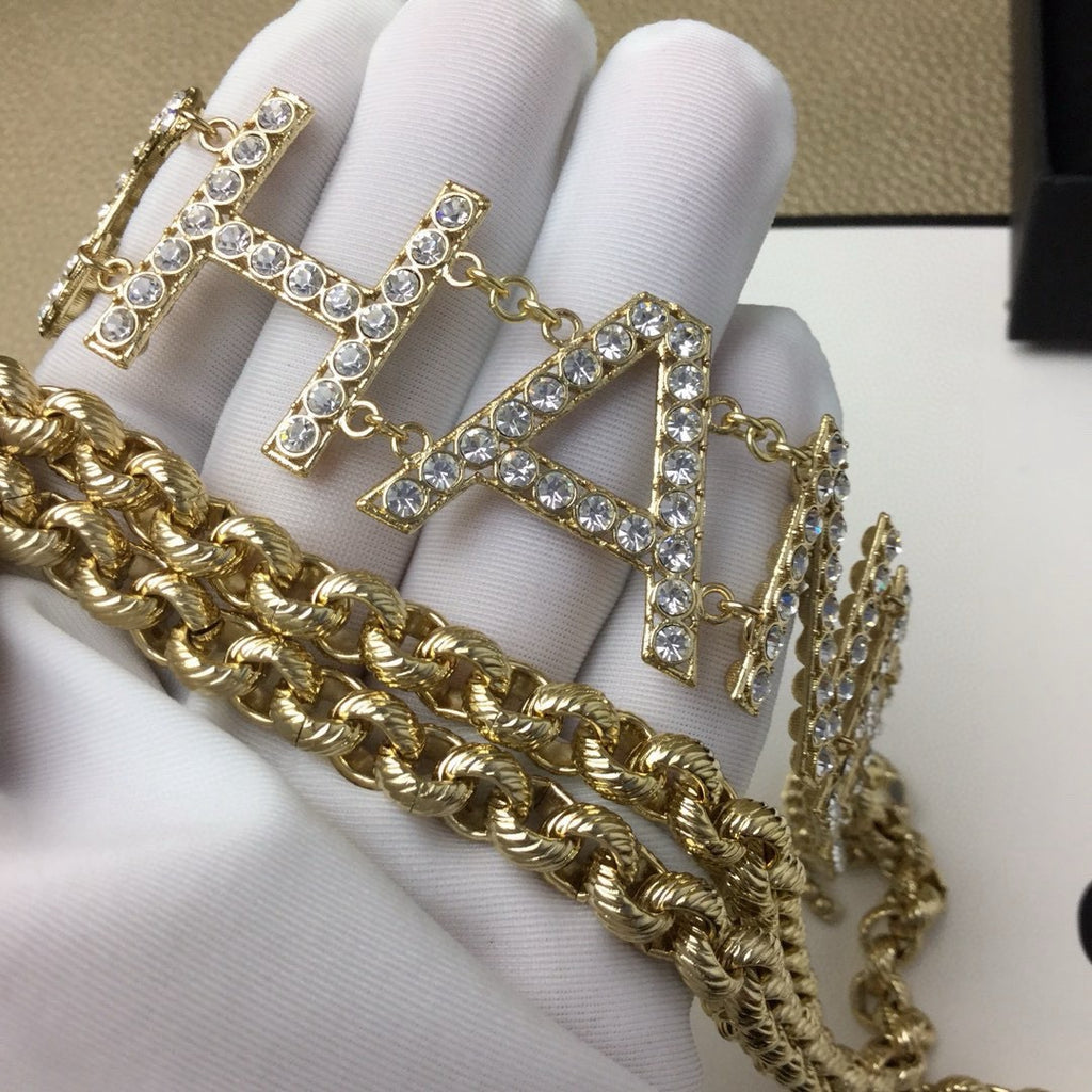 Signature Emblem Jewelry Accessory in Gold-Tone – White Detail – Design 003 close-up detail