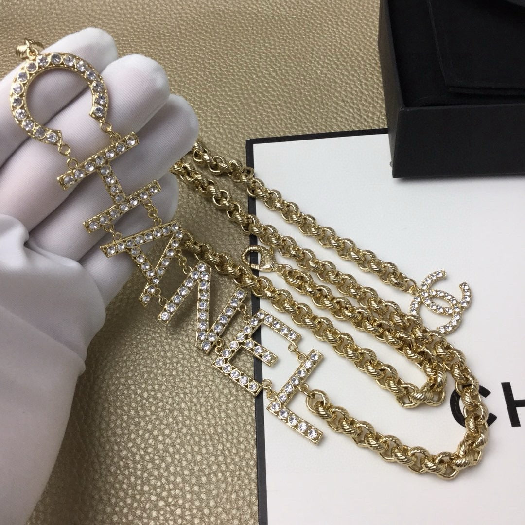 Signature Emblem Jewelry Accessory in Gold-Tone – White Detail – Design 003 detail view