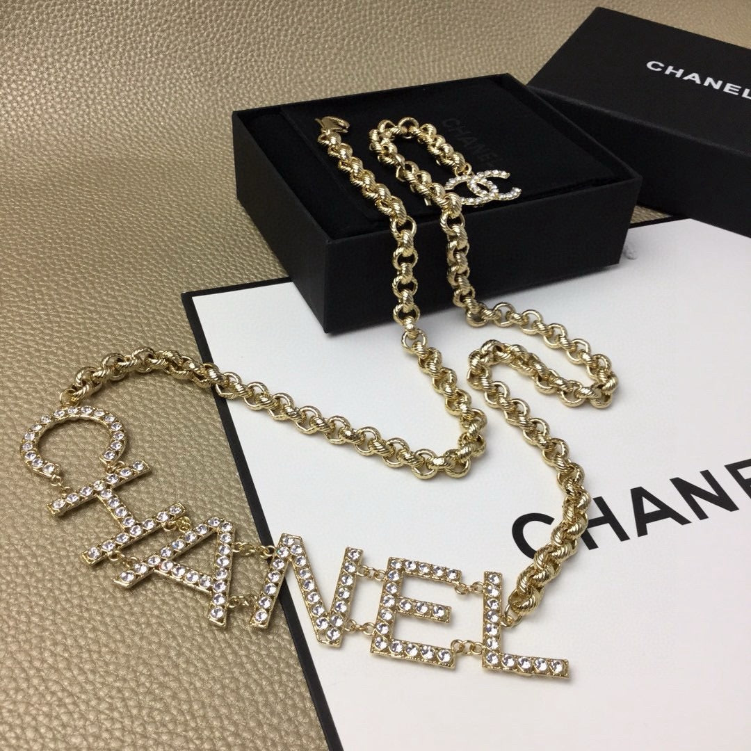 Signature Emblem Jewelry Accessory in Gold-Tone – White Detail – Design 003 front product view