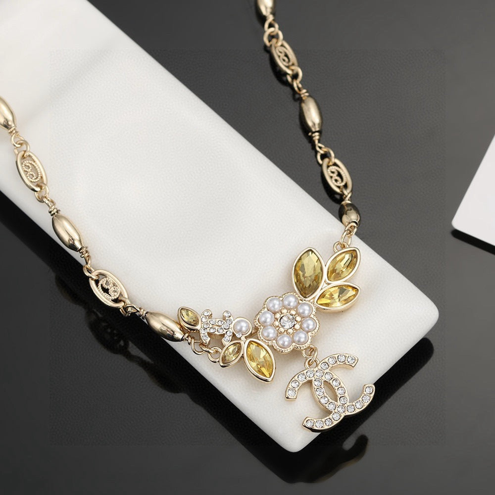Double-C Emblem Pearl-Detail Pendant Necklace – Pearl Detail – Design 073 detail view