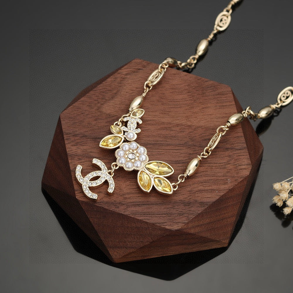 Double-C Emblem Pearl-Detail Pendant Necklace – Pearl Detail – Design 073 close-up detail