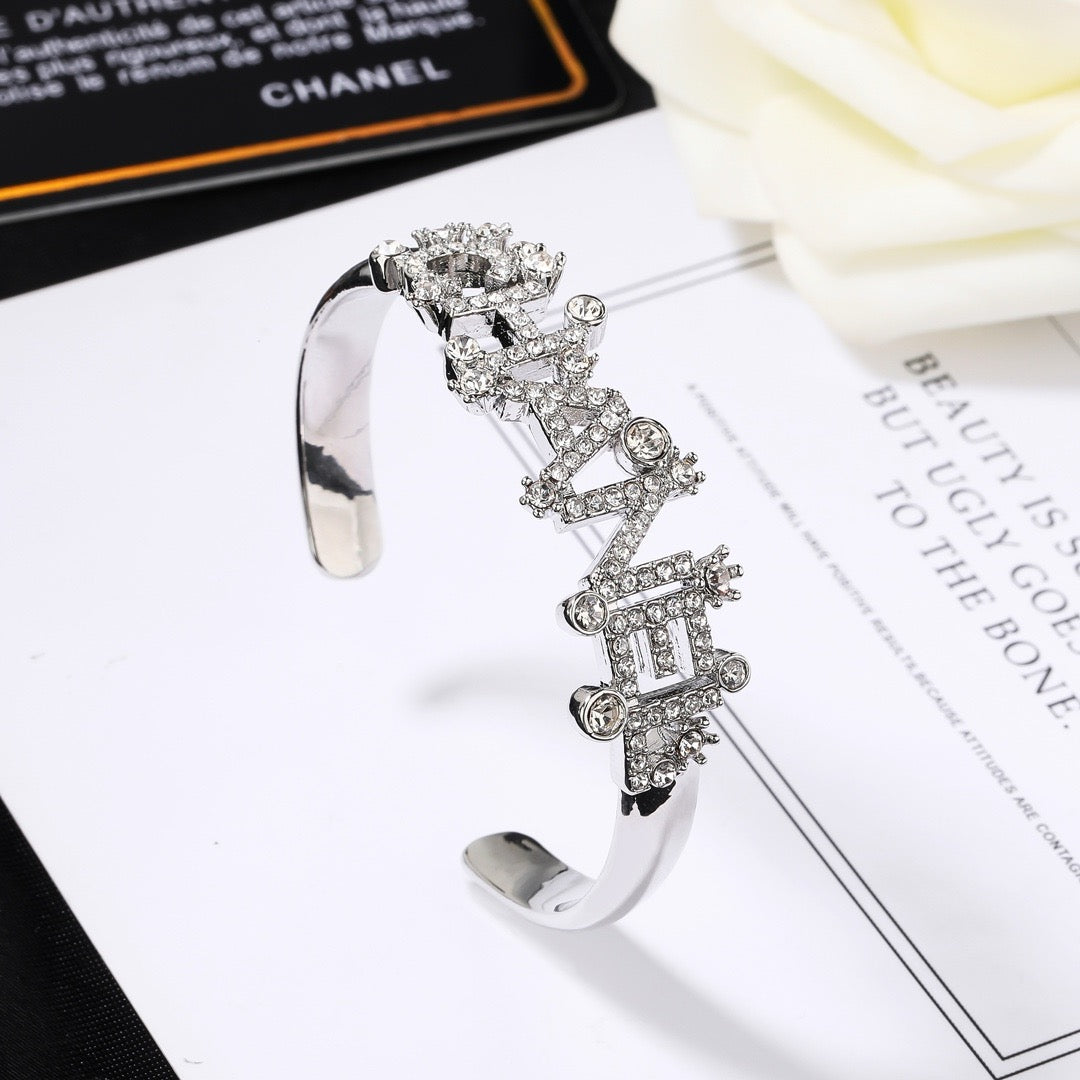 Signature Emblem Bangle in Polished Metal-Tone – Design 030 front product view