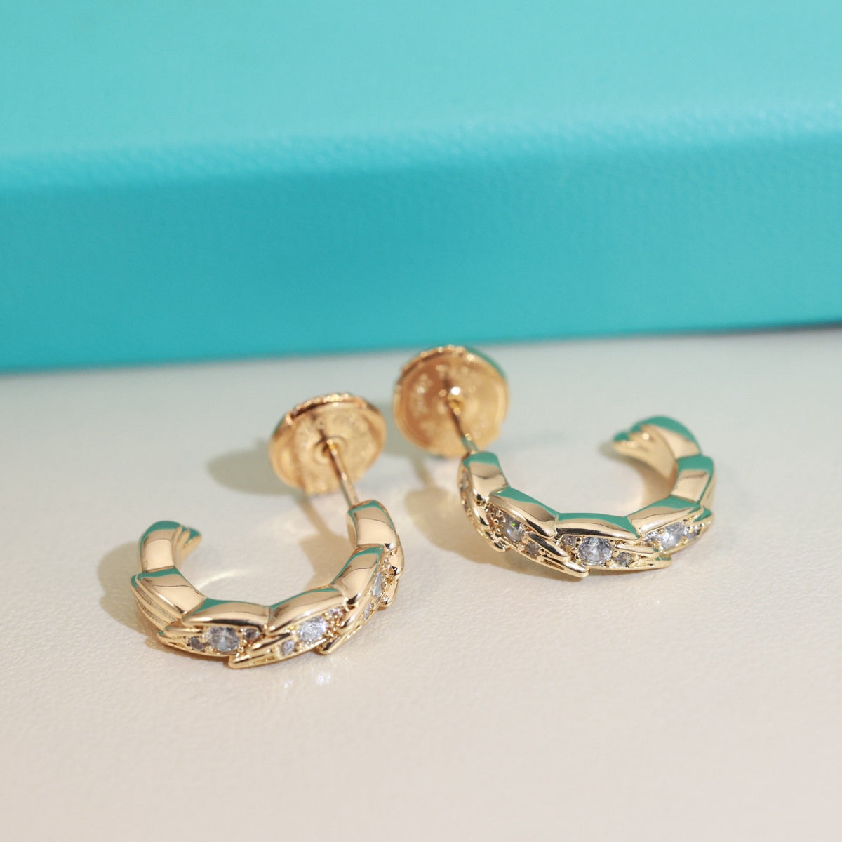 Signature Motif Stud Earrings in Polished Metal-Tone – Design 02 front product view