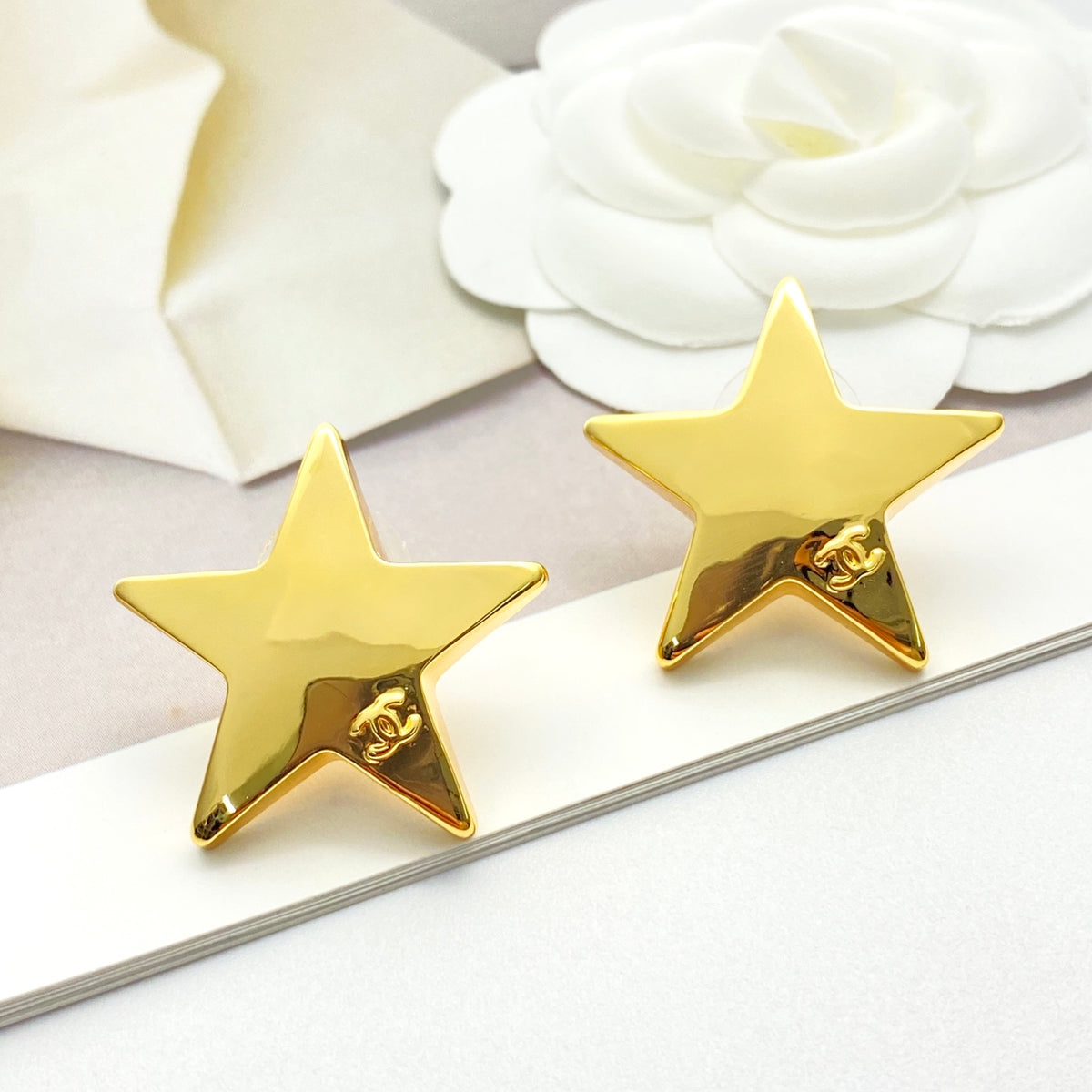 Double-C Emblem Stud Earrings in Gold-Tone – Star Detail – Design 007 styled product view
