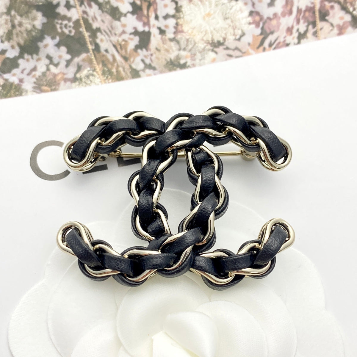 Signature Emblem Brooch in Polished Metal-Tone – Black Detail – Design 003 front product view