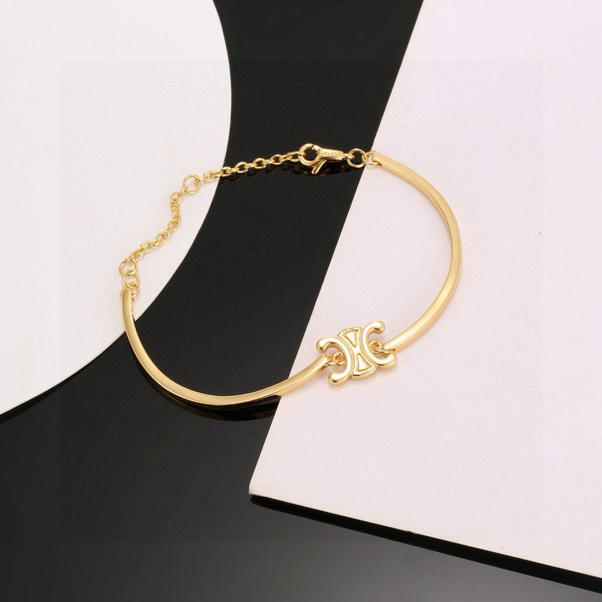 Signature Emblem Bangle in Polished Metal-Tone – Red Detail close-up detail