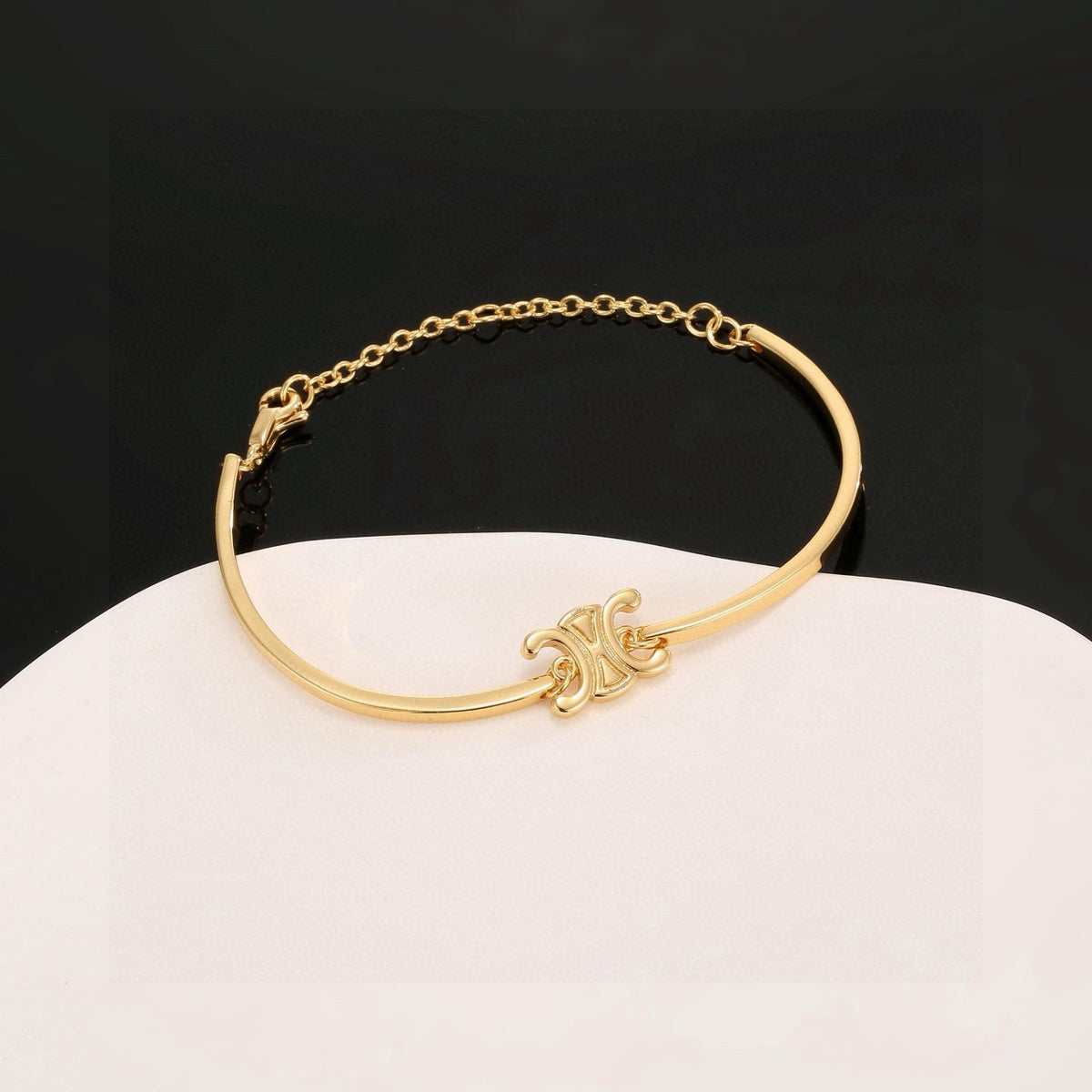 Signature Emblem Bangle in Polished Metal-Tone – Red Detail main product view