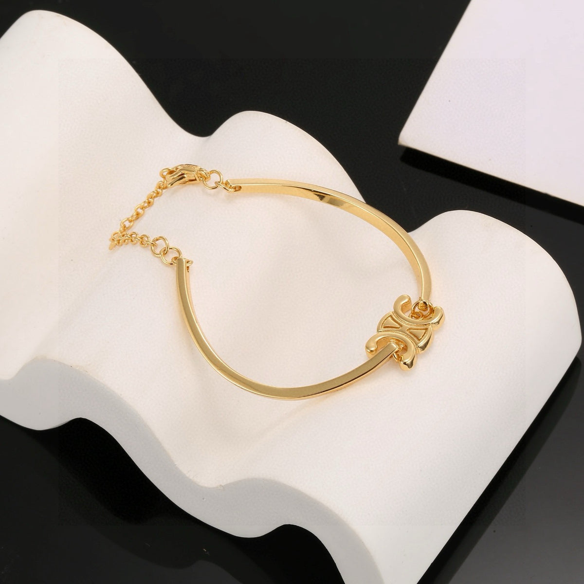 Signature Emblem Bangle in Polished Metal-Tone – Red Detail main product view