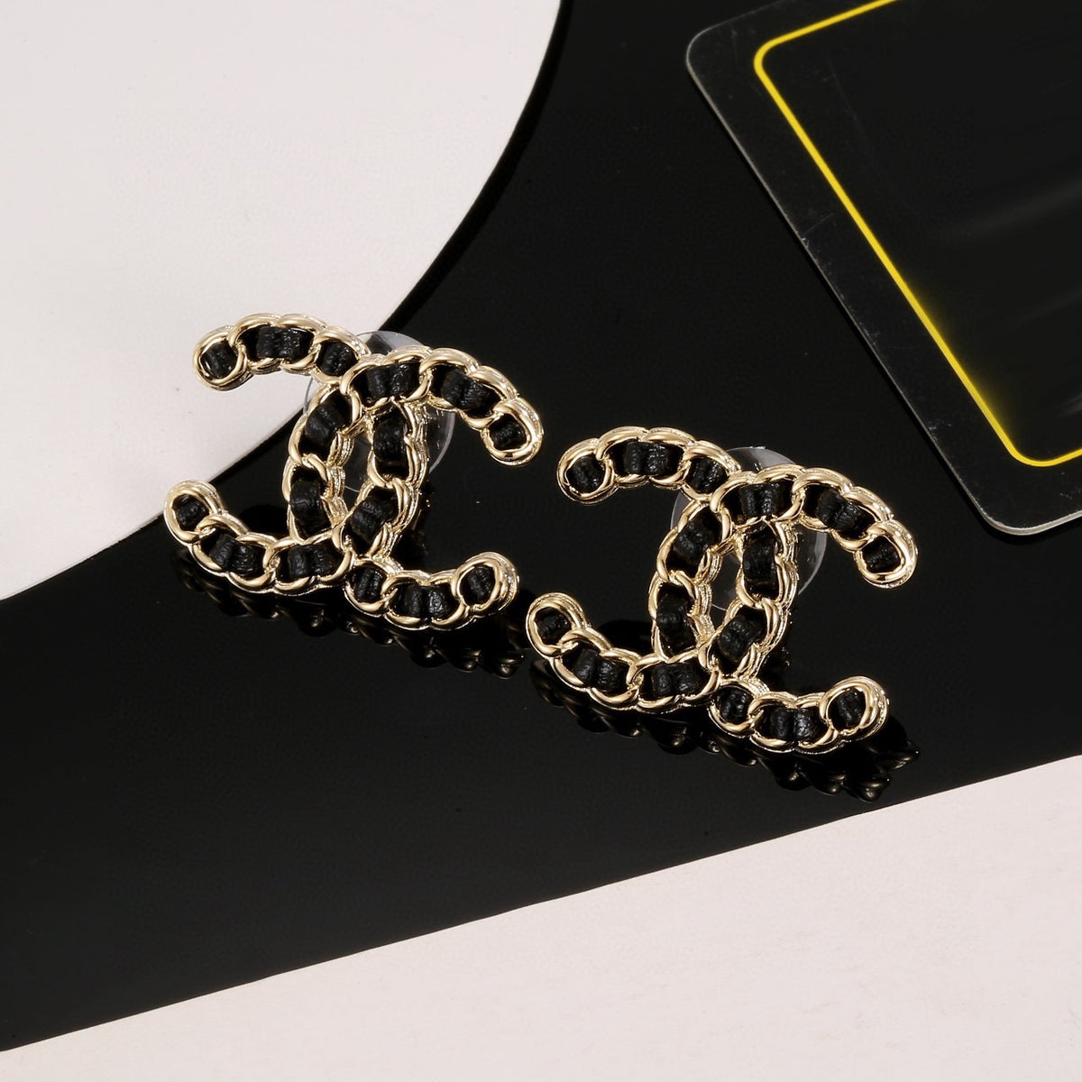 Signature Emblem Stud Earrings in Polished Metal-Tone – Black Detail – Design 002 detail view