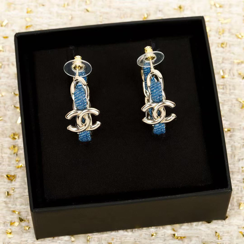 Signature Emblem Crystal-Accent Stud Earrings – Blue Detail close-up detail