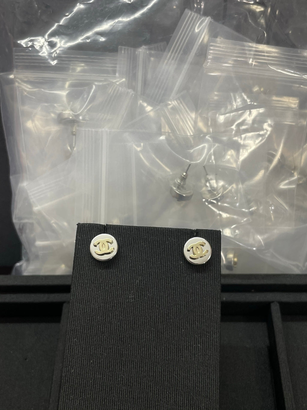 Double-C Emblem Stud Earrings in Polished Metal-Tone – Design 324 detail view