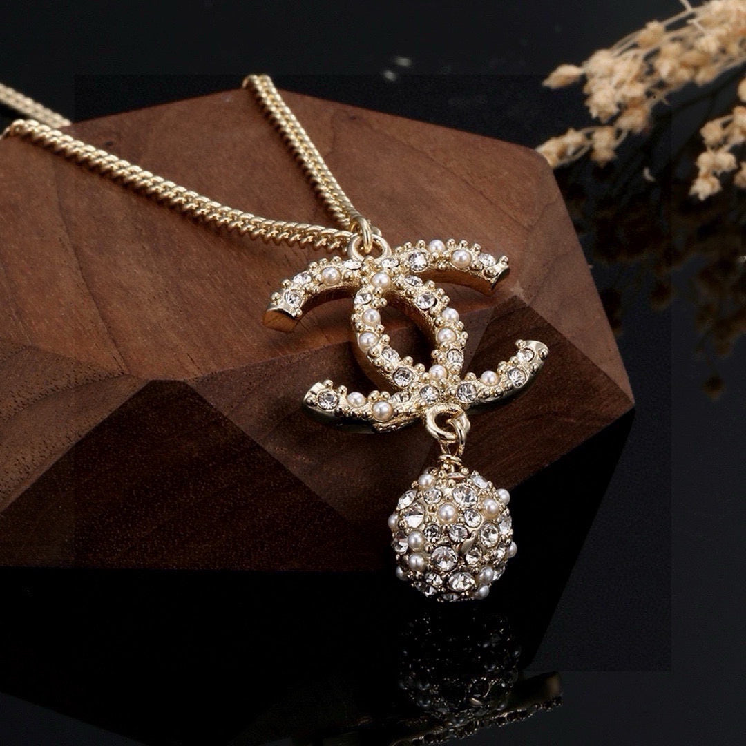 Double-C Emblem Pearl-Detail Pendant Necklace – Pearl Detail – Design 097 styled product view