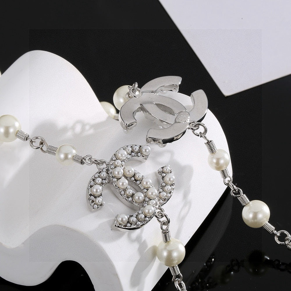 Double-C Emblem Pearl-Detail Pendant Necklace – Pearl Detail – Design 096 close-up detail