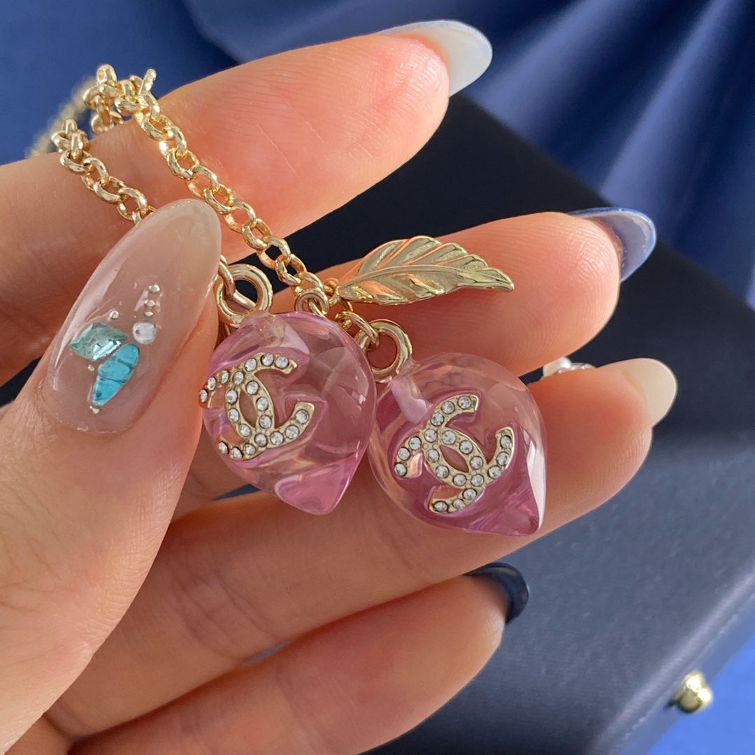 Double-C Emblem Crystal-Accent Pendant Necklace – Pink Detail – Design 003 front product view