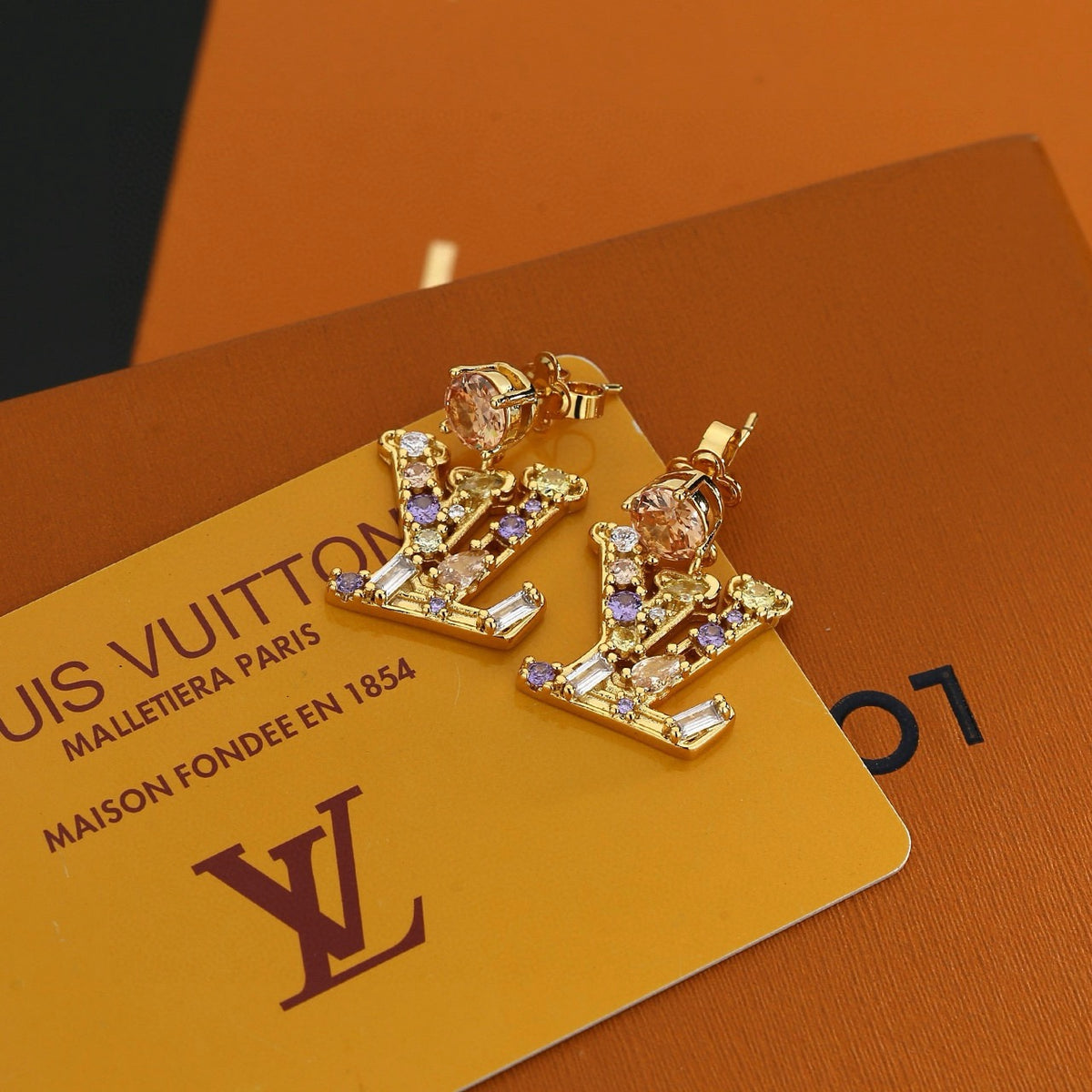 Letter Emblem Stud Earrings in Polished Metal-Tone – Design 006 front product view