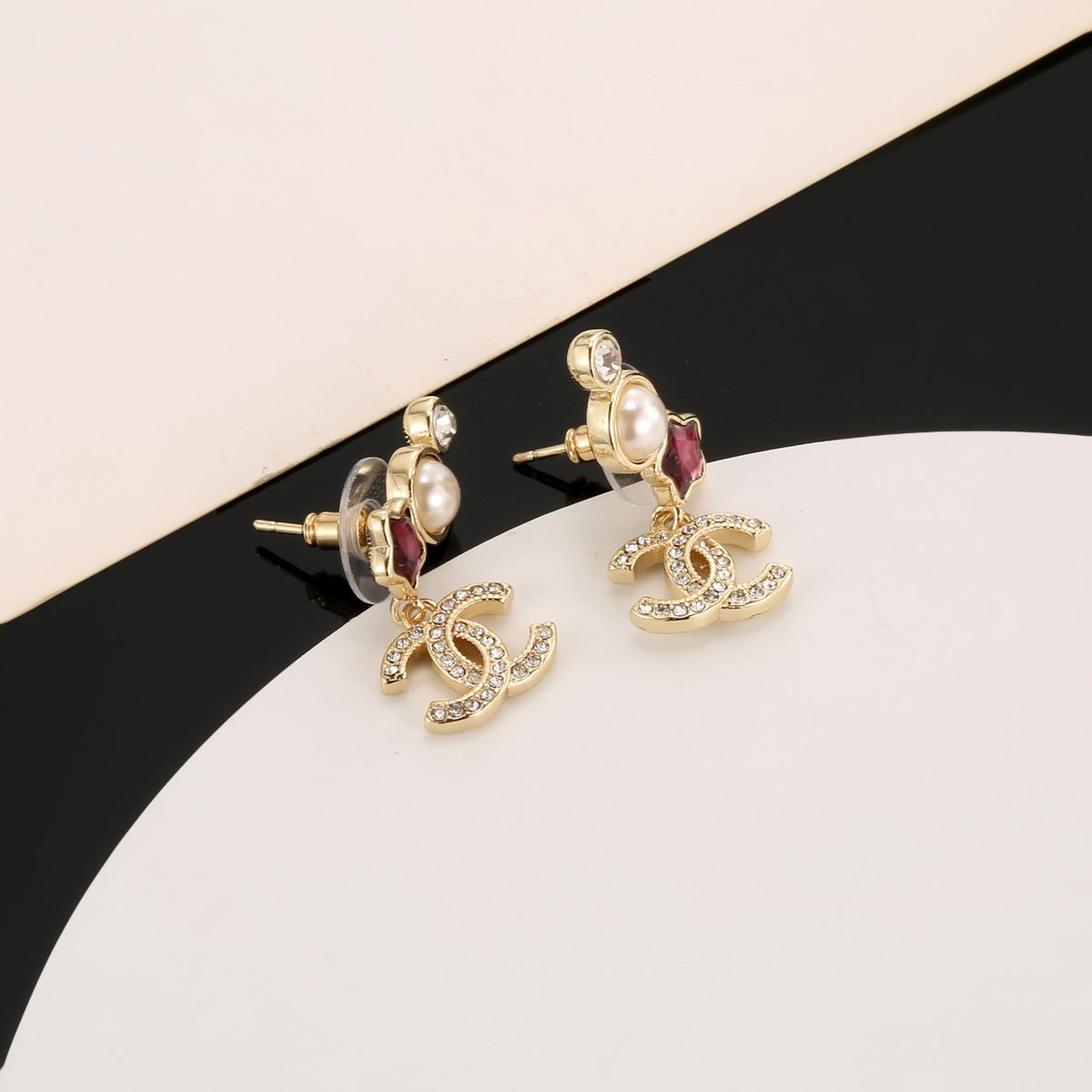 Double-C Emblem Stud Earrings in Gold-Tone – Star Detail – Design 008 close-up detail