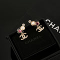 Double-C Emblem Stud Earrings in Gold-Tone – Star Detail – Design 003 main product view