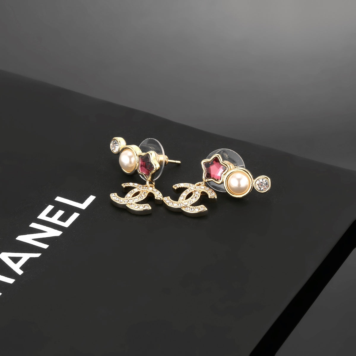 Double-C Emblem Stud Earrings in Gold-Tone – Star Detail – Design 008 styled product view
