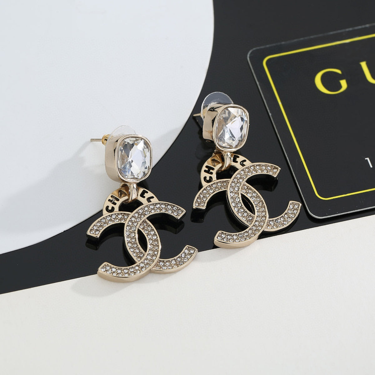 Double-C Emblem Stud Earrings in Gold-Tone – Design 034 detail view