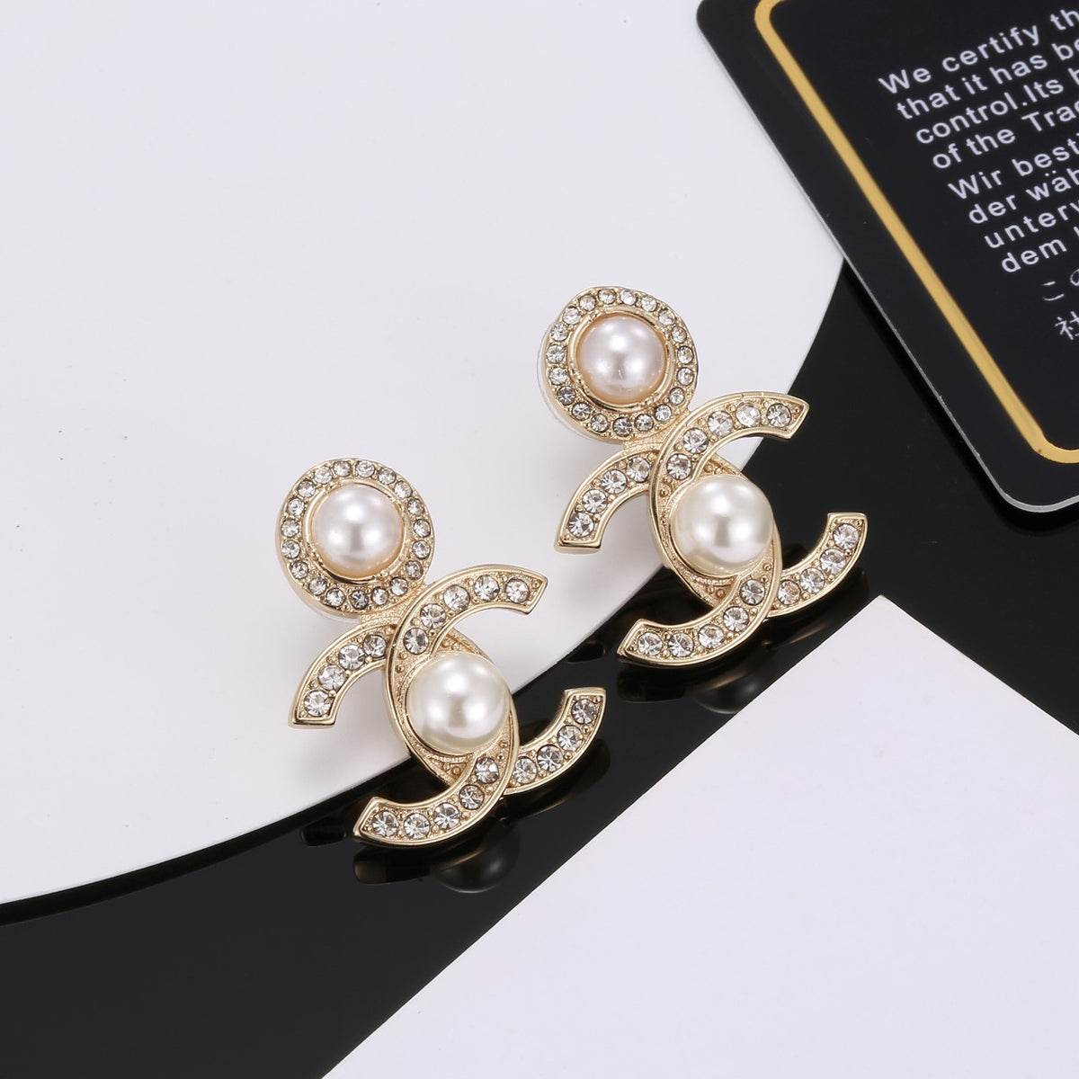 Signature Emblem Stud Earrings in Polished Metal-Tone – Design 022 close-up detail