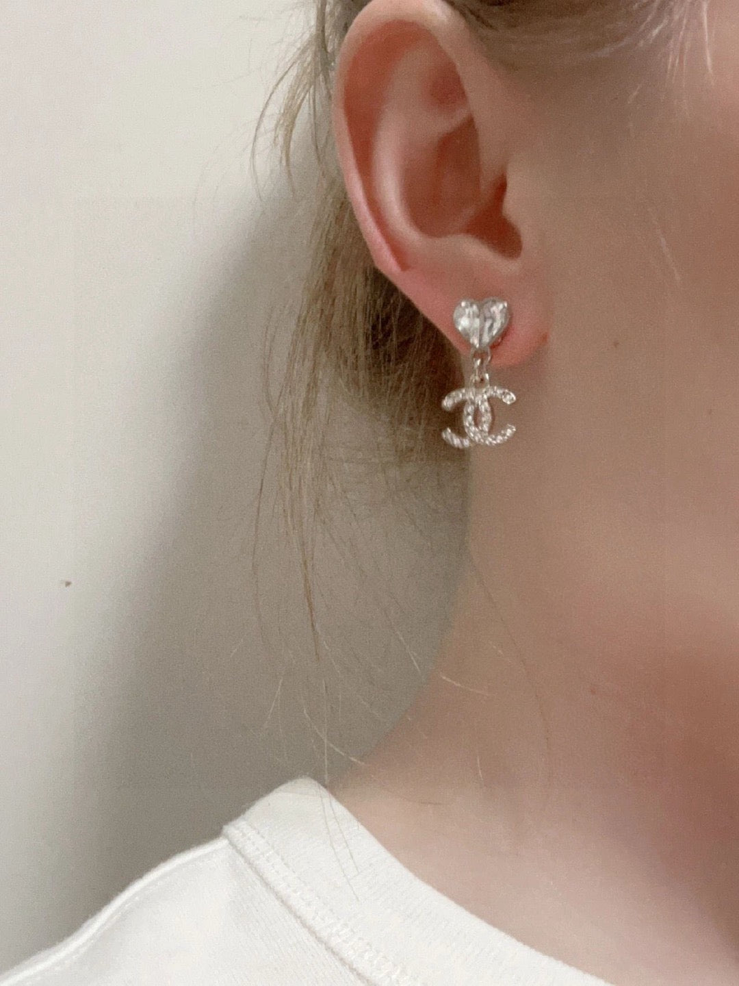 Double-C Emblem Stud Earrings in Polished Metal-Tone – Design 350 front product view