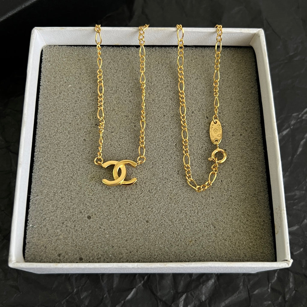 Double-C Emblem Pendant Necklace in Polished Metal-Tone – Design 064 close-up detail